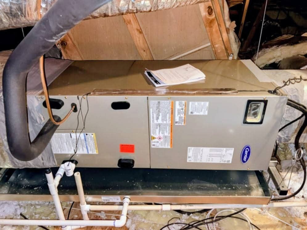 Carrier air handler in an attic, front view