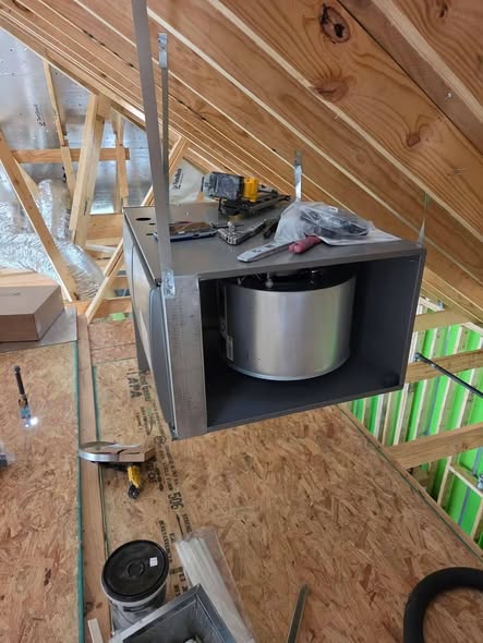 Blower unit being installed in an attic